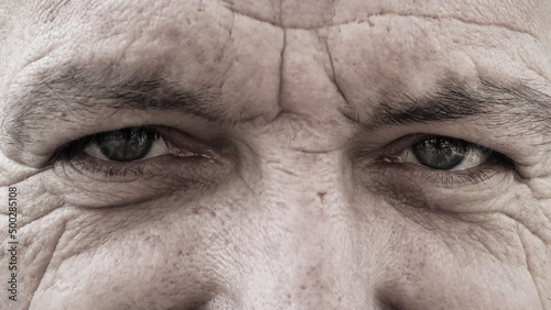 Portrait of senior man with wrinkles on his face. Black and white picture