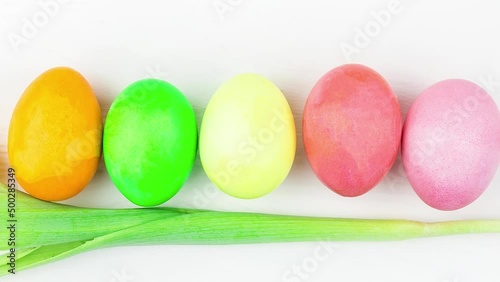 Easter eggs and a flower on a white background