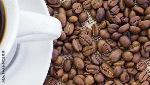 coffee Cup and coffee beans on burlap