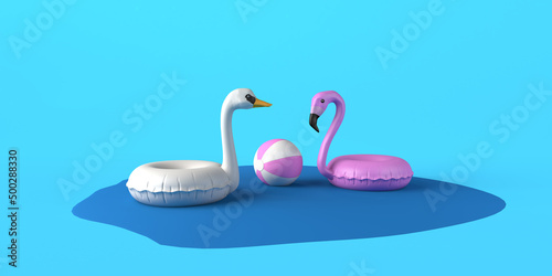 Fototapeta Naklejka Na Ścianę i Meble -  Pink flamingo and white swan inflatable float floating in a pool of water with beach ball. 3D illustration. Copy space.