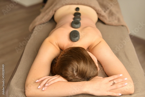 woman receiving stone massage
