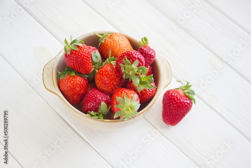 Bowl of Fresh strawberries on white
