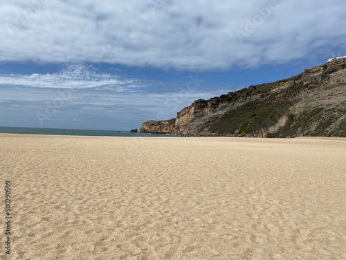 sand dunes and sea, blue sky with clouds. nature