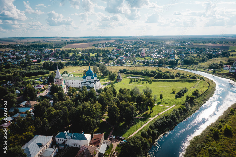 Aerial view panorama of cityscape of the Suzdal Kremlin on a bend of the Kamenka river. Russia, Vladimir region, Golden Ring of Russia