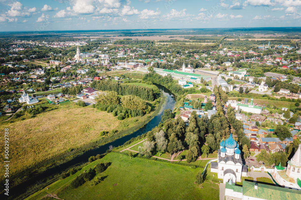 Aerial view panorama of cityscape of the Suzdal Kremlin on a bend of the Kamenka river. Russia, Vladimir region, Golden Ring of Russia