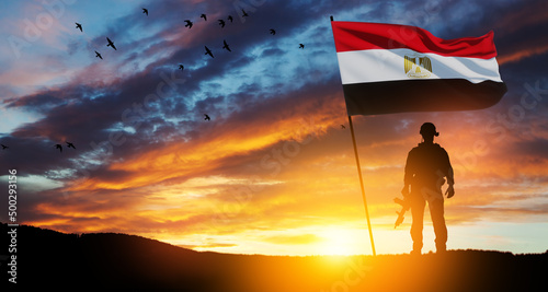 Silhouette Of A Solider Against the Sunrise in desert . Concept - armed forces of Egypt. Egypt celebration. Greeting card for Independence day, Memorial Day, Armed forces day, Sinai Liberation Day.