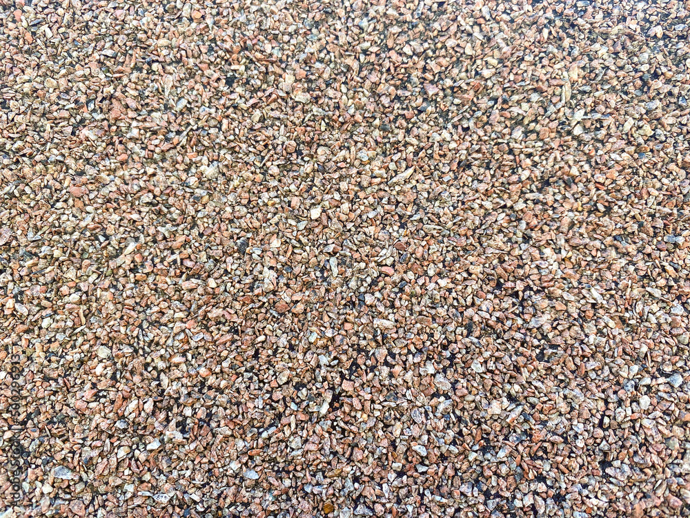 sports ground cover. rubber coating with small patches. pink rubber pebbles. material for sports, anti-slip coating sports ground cover. rubber coating with small patches. pink rubber pebbles. material for sports, anti-slip coating