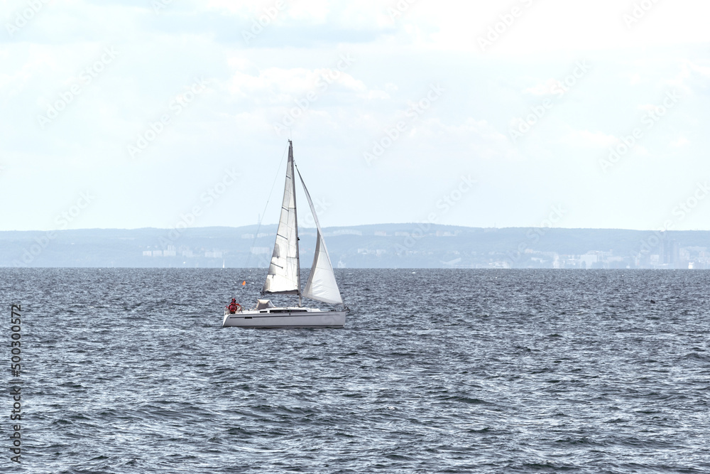 Sailing boat on the sea with blue sky