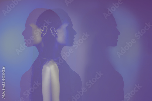 bipolar mental disorder. Double face. Split personality. Conceptual mood disorder. Dual personality concept. 2 silhouettes of a female head. mental health. Imagination. photo