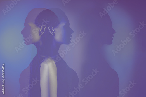 bipolar mental disorder. Double face. Split personality. Conceptual mood disorder. Dual personality concept. 2 silhouettes of a female head. mental health. Imagination.