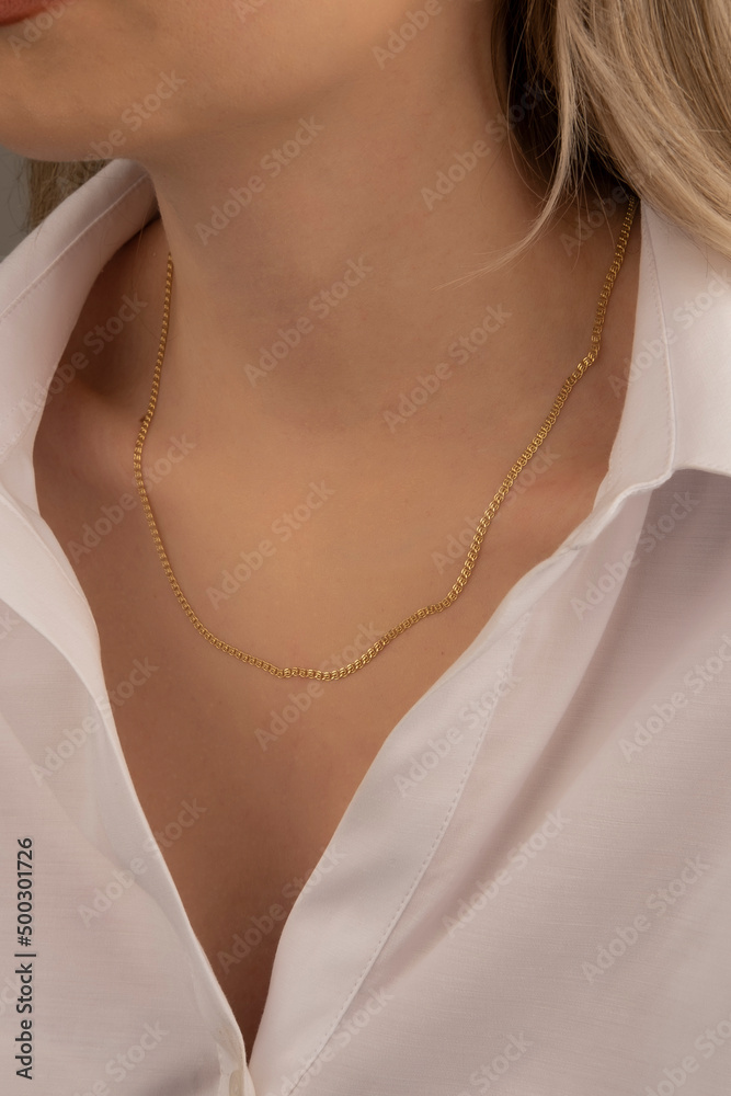 Silver and Gold Jewelry Necklace on Young Woman's Neck