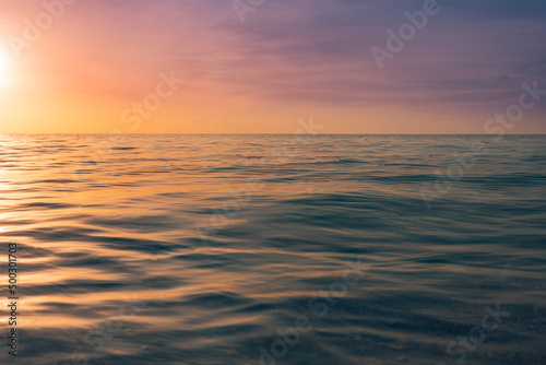 Closeup sea sand beach. Amazing beach landscape. Inspire tropical beach seascape horizon. Abstract golden sunset sky calmness tranquil relaxing sunlight summer freedom. Vacation travel holiday nature