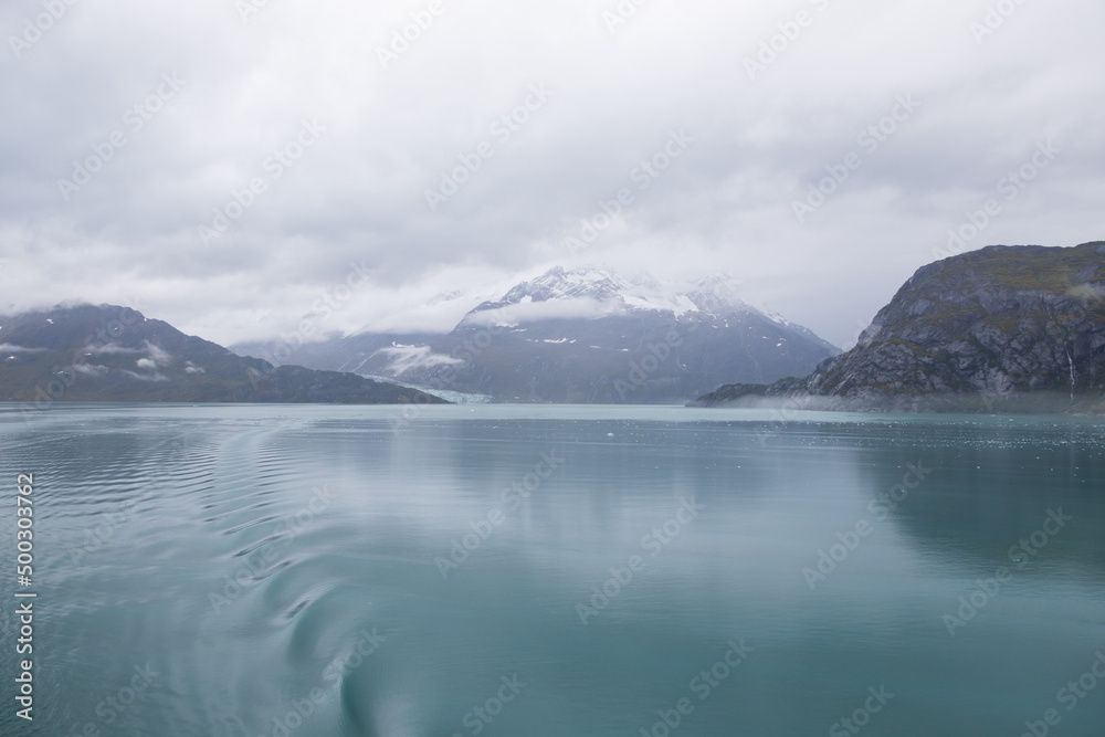 Ice chunks in the water and mountain background at Glacier Bay, Alaska, USA		