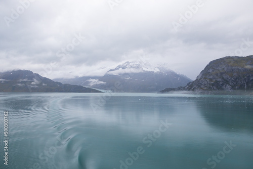 Ice chunks in the water and mountain background at Glacier Bay, Alaska, USA 