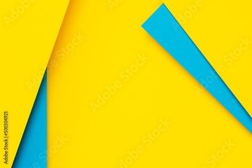 Free Download Abstract color papers geometry flat lay composition background with blue and yellow tones - GFXLoad