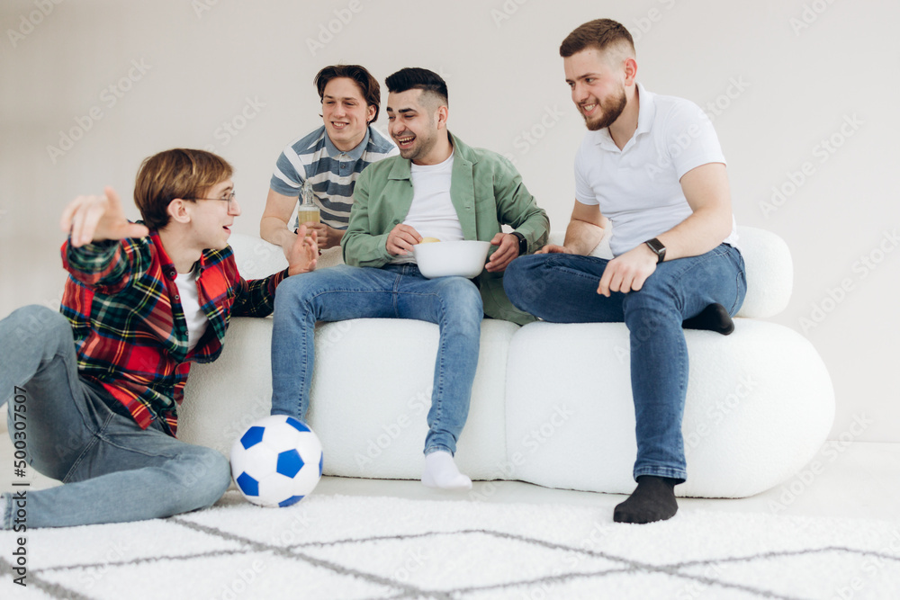 A group of friends watching a football match on TV. Football Fans