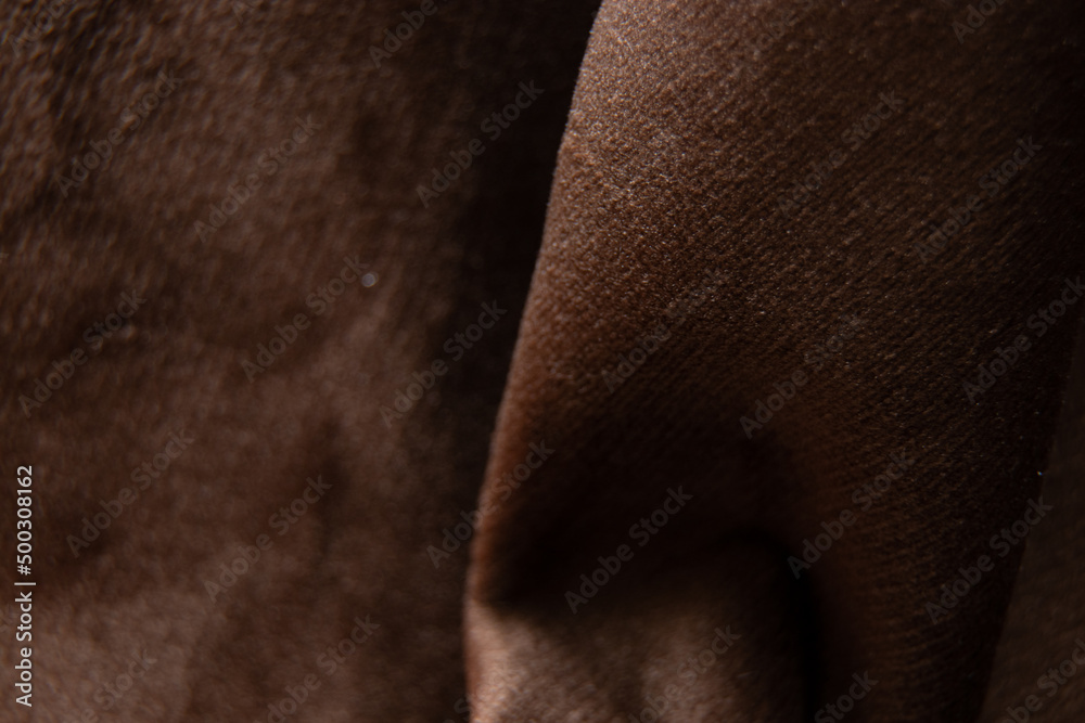 Soft dark brown wrinkled fabric macro photo, fabrics on the example of furniture Soft dark brown wrinkled fabric macro photo, fabrics on the example of furniture