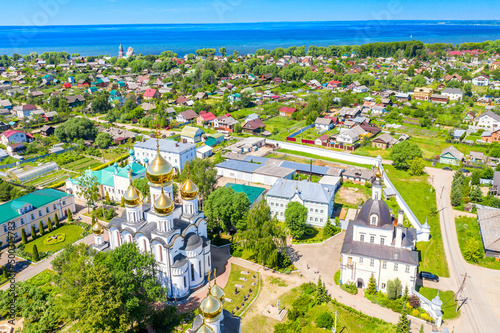 Aerial drone view of Nikolsky monastery in Pereslavl Zalessky with church of the Forty Martyrs of Sebastia and lake Pleshcheyevo, Yaroslavl Region, Russia. Summer sunny day.  photo