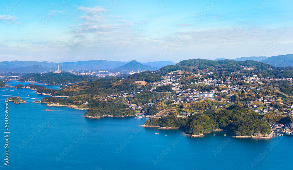 Bird's-eye view of a seascape of Sasebo called Kujūkushima meaning 99 Islands famous for its saw-toothed coast with multiple islets part of Saikai National Park in Kyushu.