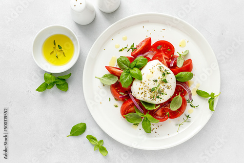 Salad Caprese with tomato, mozzarella and basil, italian food