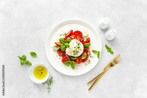 Salad Caprese with tomato, mozzarella and basil, italian food photo