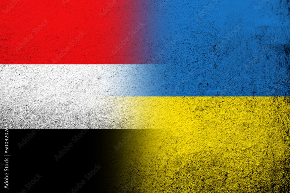 National flag of Yemen with National flag of Ukraine. Grunge background