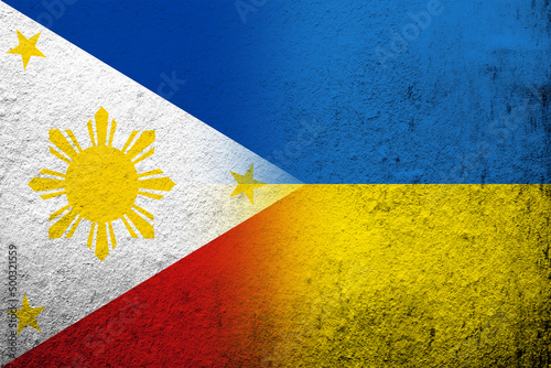 The Republic of the Philippines National flag with National flag of Ukraine. Grunge background