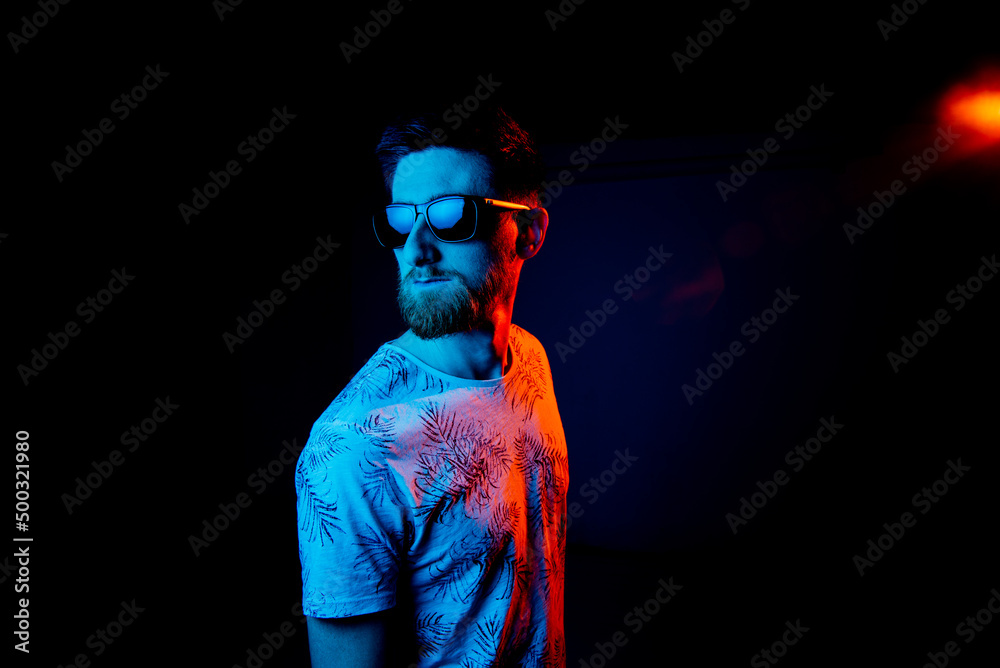 Man in sunglasses in neon light Man in sunglasses in neon light