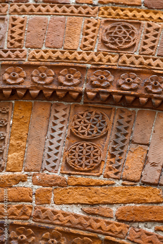 Lucca - the architectural detail. Magnificently adorned bricks in the historic civic centre