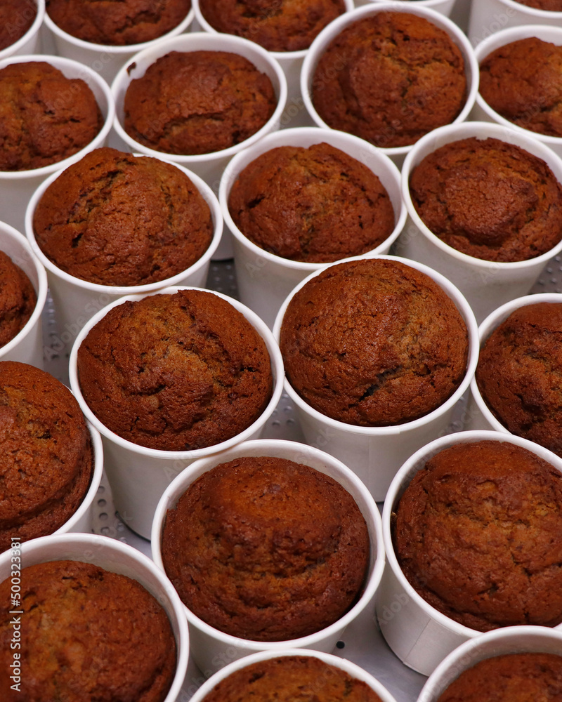 a batch of baked date pudding in white cups a batch of baked date pudding in white cups