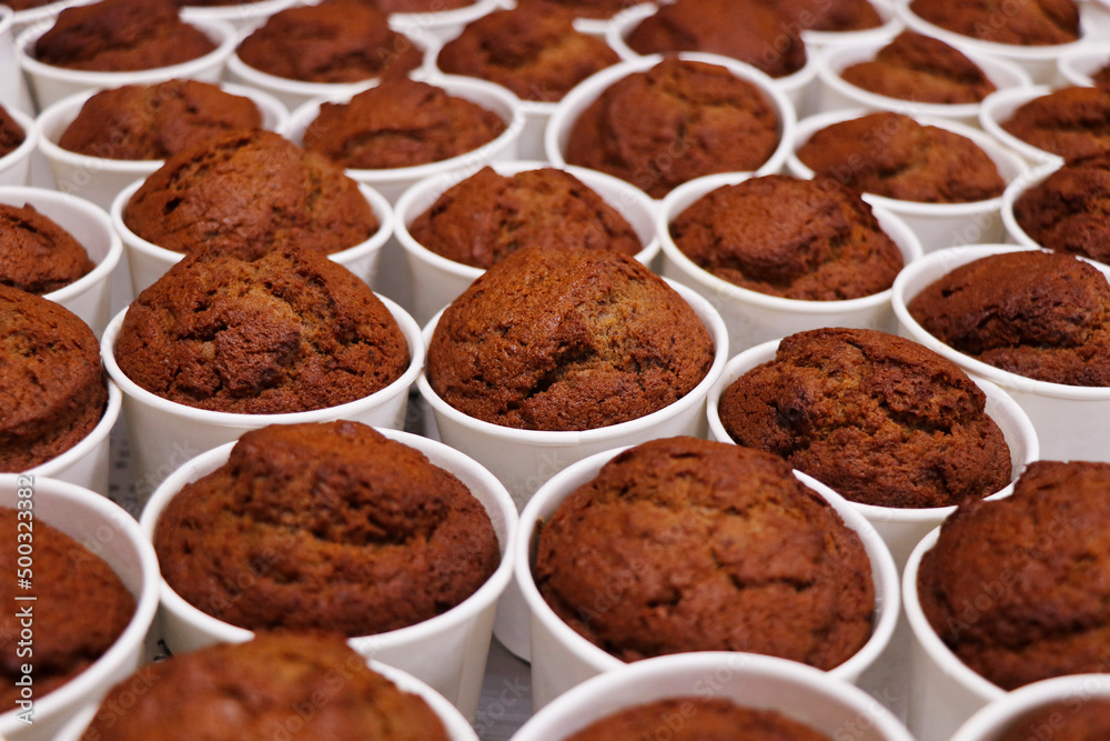 production of baked date pudding in white cups production of baked date pudding in white cups