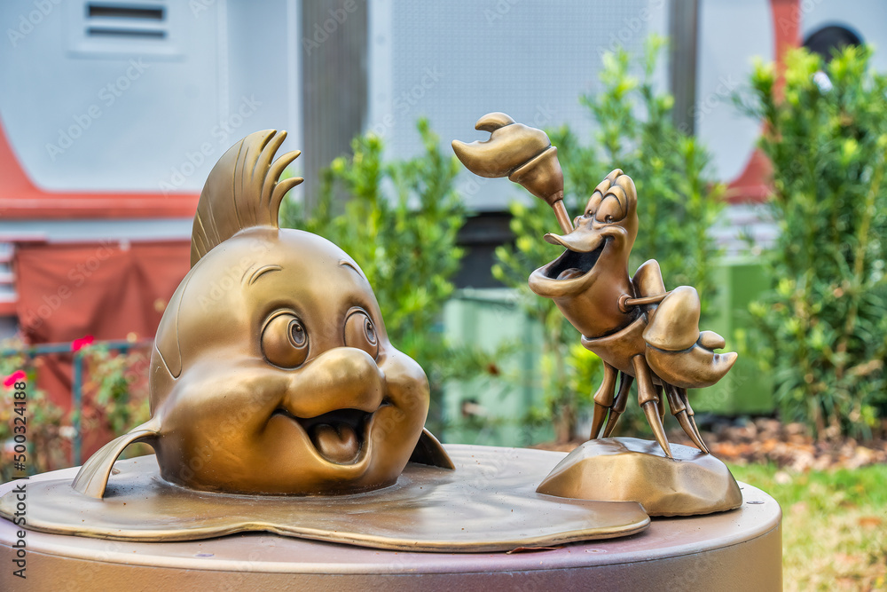 Sebastian and Flounder Gold Statue 50th Anniversary Disney Stock Photo ...