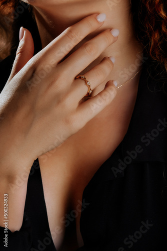 Close-up of an elegant engagement diamond ring on beautiful woman s finger. love and wedding concept. Like the split tone Instragram process.