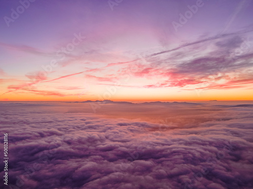 Sunset Above Clouds & Mountains from Drone