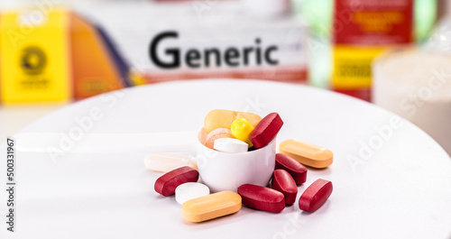 different pills and boxes of generic medicine, have the same characteristics and produce the same effects in the body as a branded medicine photo