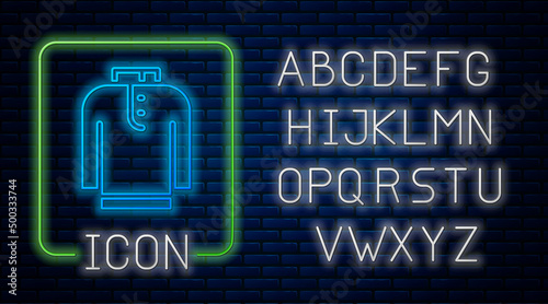 Glowing neon Shirt kurta icon isolated on brick wall background. Neon light alphabet. Vector