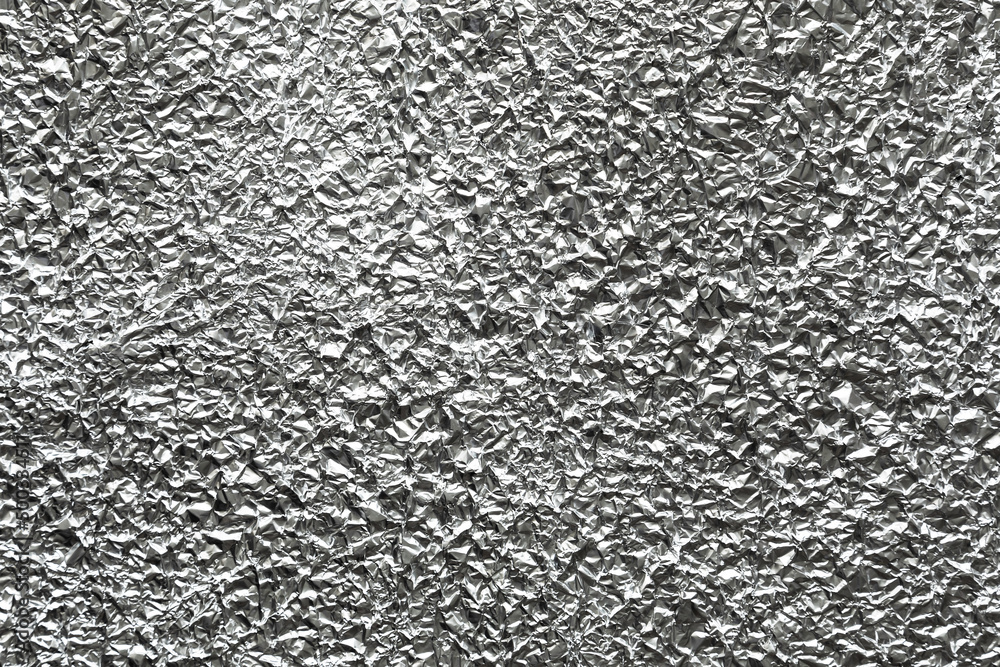 Silver crumpled aluminum tin foil graphic design element. Silver crumpled aluminum tin foil graphic design element.