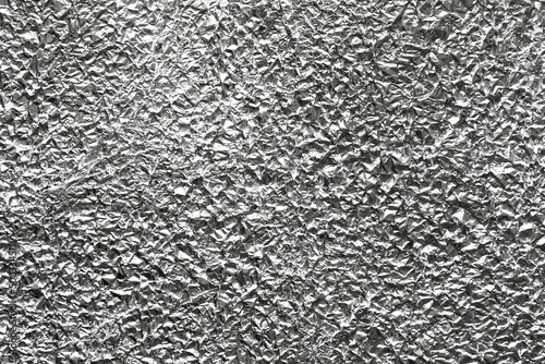 Silver crumpled aluminum tin foil graphic design element.
