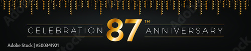 87th anniversary. Eighty-seven years birthday celebration horizontal banner with bright golden color. photo