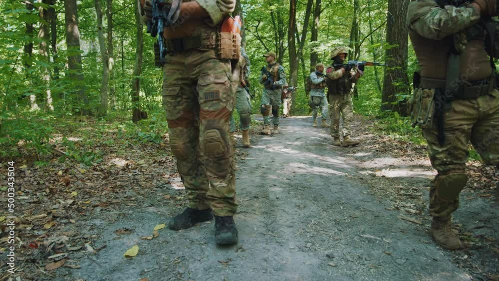 Group soldiers with fully equipped hold rifle wearing camouflage ...