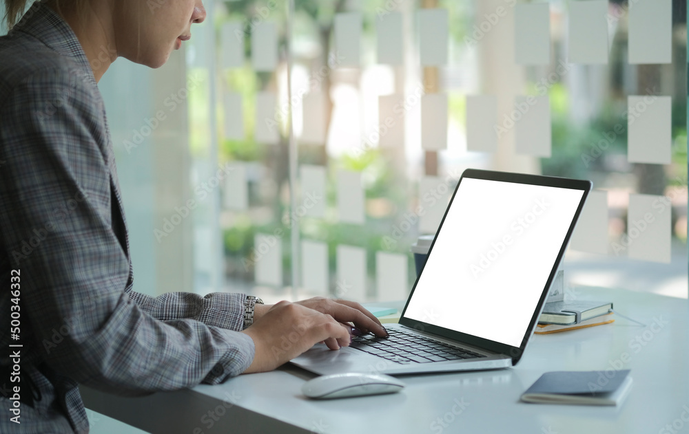 Focused businesswoman using laptop computer at bright modern office. Focused businesswoman using laptop computer at bright modern office.