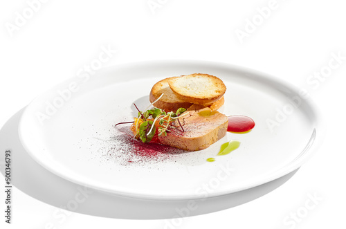 Chicken liver pate with toasted bread and jam isolated on white background. Meat terrine with citrus and toast. Restaurant food - duck pate with baguette on white plate. Meat appetizer.