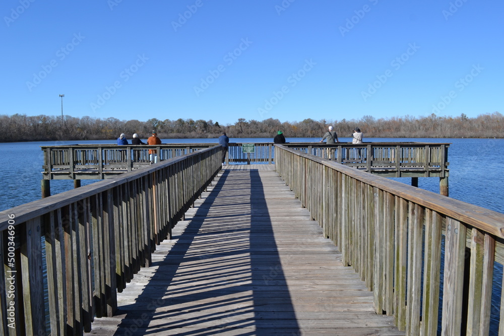 People on the fishing pier, White Lake, Cullinan Park Conservatory, Sugar Land, Texas