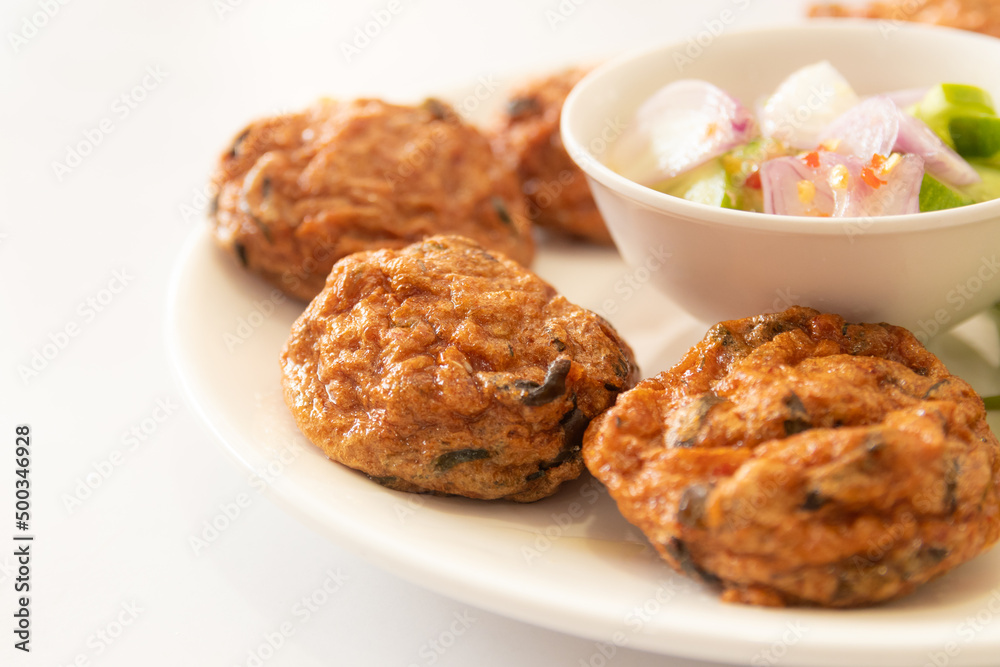 Thai fish cakes with dipping sauce. Thai food Thai fish cakes with dipping sauce. Thai food