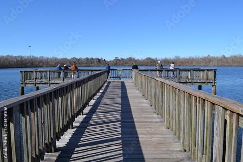 People on the fishing pier, White Lake, Cullinan Park Conservatory, Sugar Land, Texas © Marta