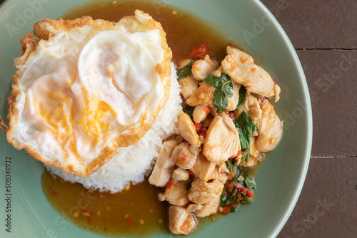 Stir fried Thai basil with chicken and a fried egg. Thai food