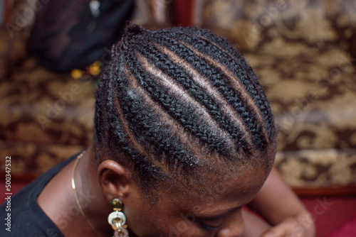 Front view of weave on hair style on the head of an African Nigerian female client