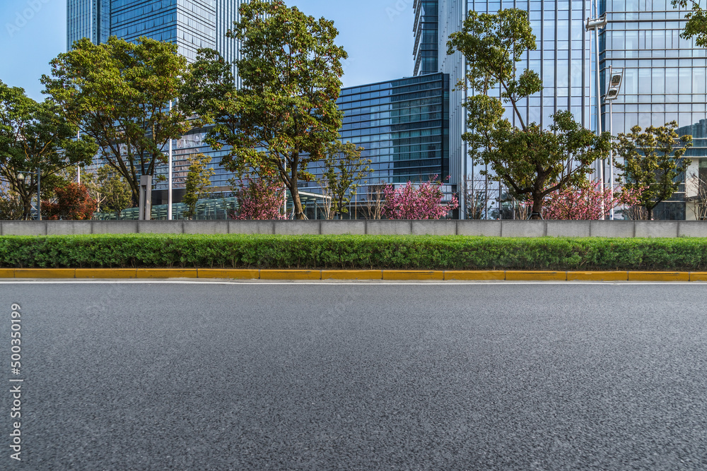 city empty traffic road with cityscape in background.