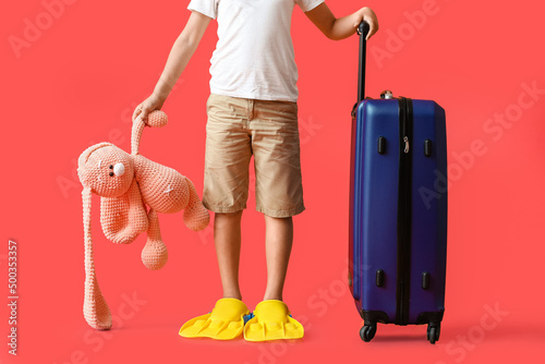 Cute little boy with suitca...