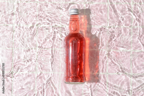 Bottle of tasty soda in wat...